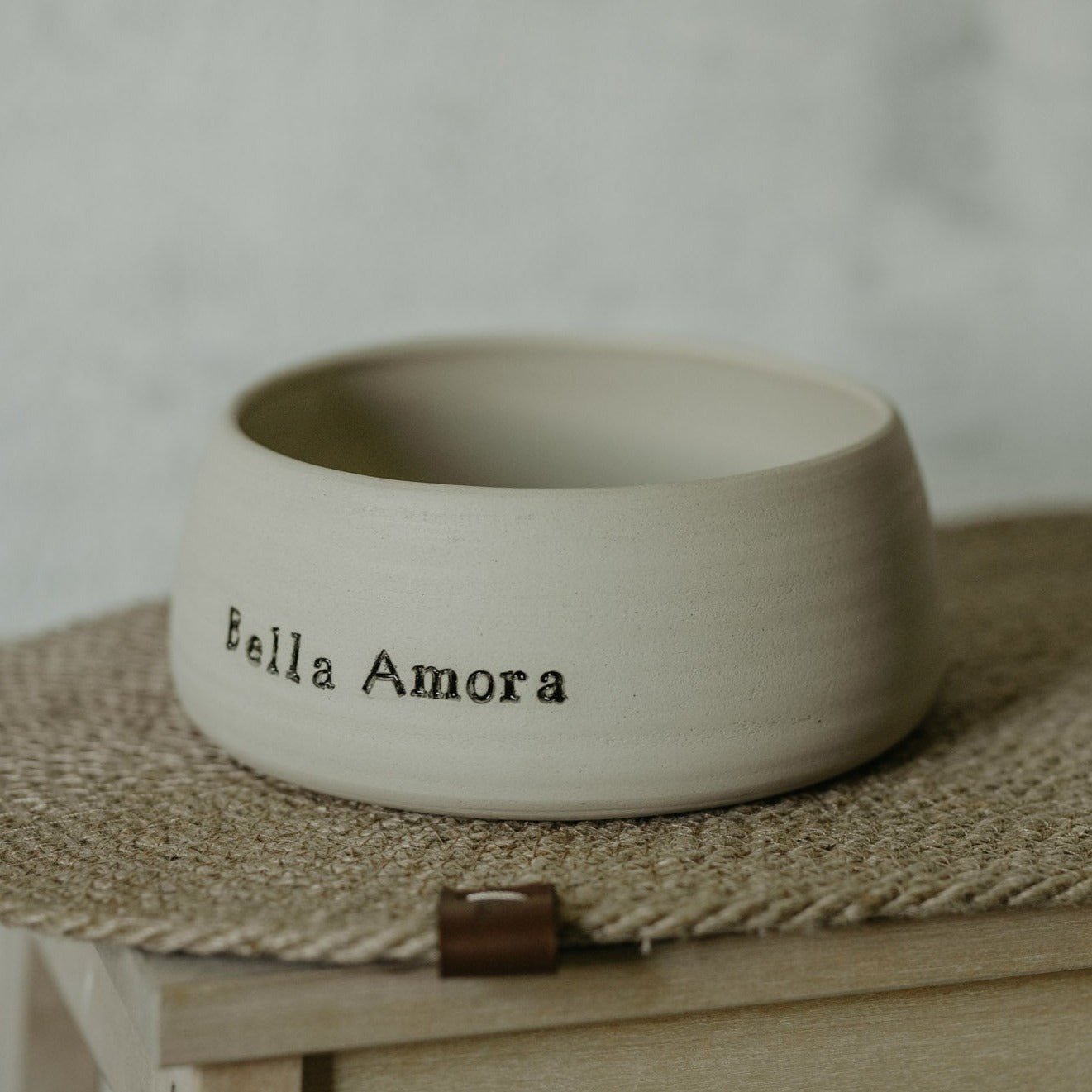 Handmade pet bowl in cream white stoneware - minimalist design for a stylish mealtime.