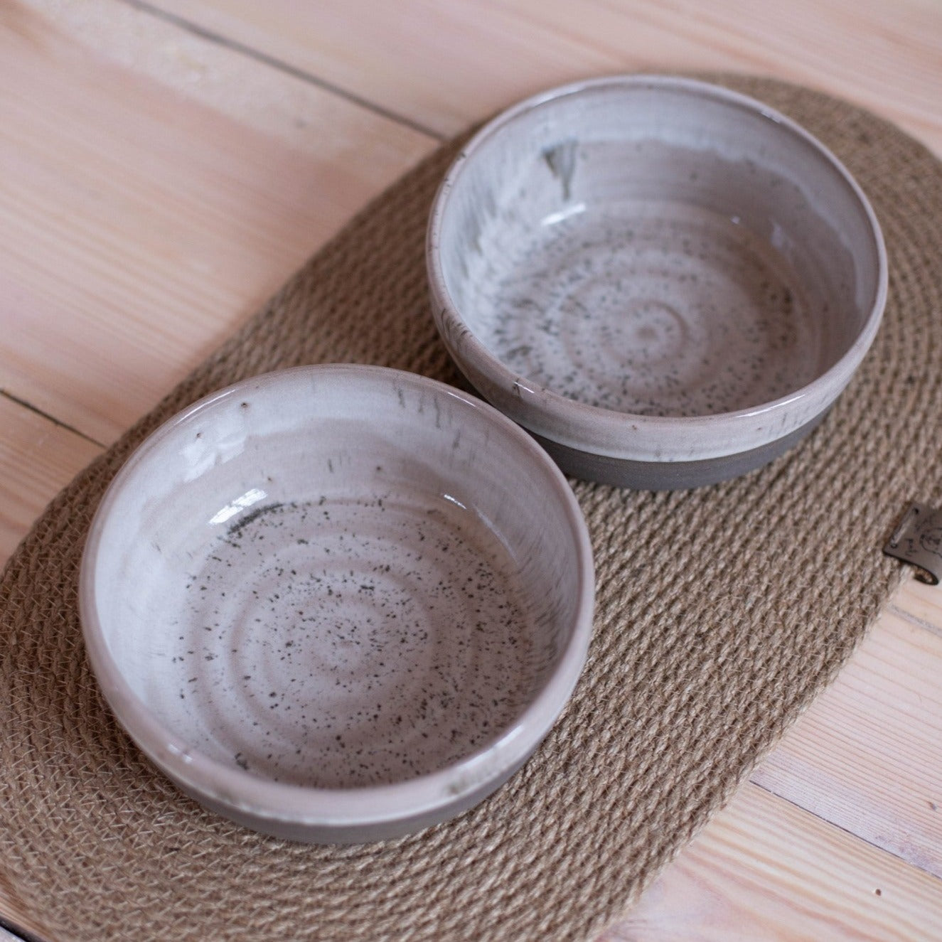 Modern dog bowl set in speckled gray ceramic. Perfect for keeping food and water organized.