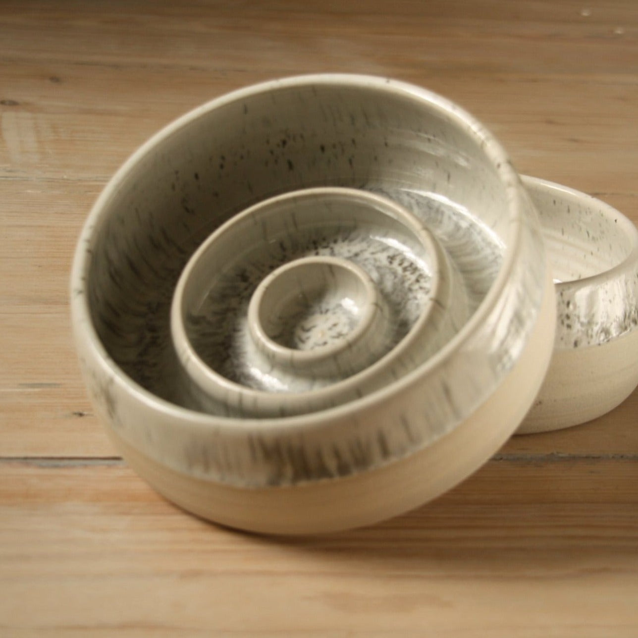 White speckled ceramic slow feeder dog bowl