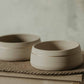 Medium-sized dog feeding set - gold hand-painted accents on white stoneware.